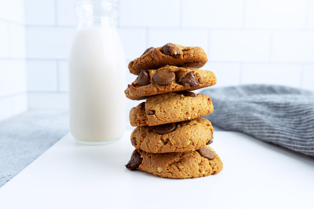pili chocolate chip cookie with jug of milk